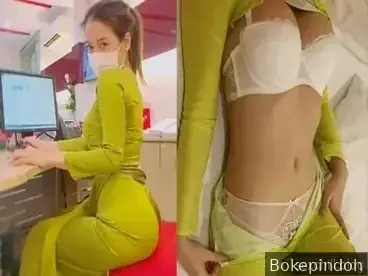 Pohon jeruk nipis, kamu adalah resepsionis hotel yang cantik mengenakan kebaya.